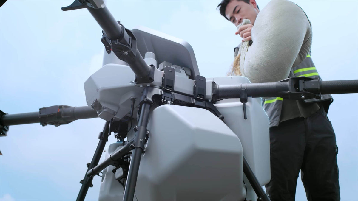 Official DJI T100 150 L spreading tank mounted on aircraft. Aircraft sold separately.