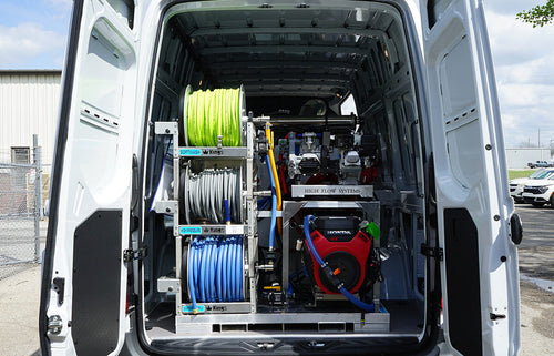 Rear view of the APEX cleaning skid installation for illustration; van is not included.
